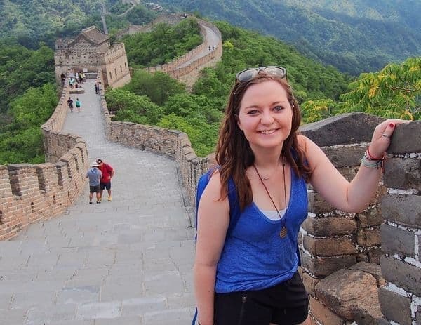 Student Standing Next to Great Wall of China