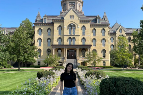 Yosibel Cabrera '26 in front of the Golden Dome.